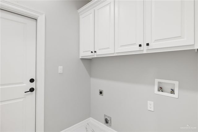 washroom featuring cabinets, washer hookup, and electric dryer hookup