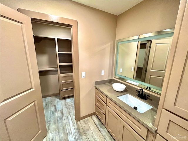 bathroom featuring vanity and wood-type flooring