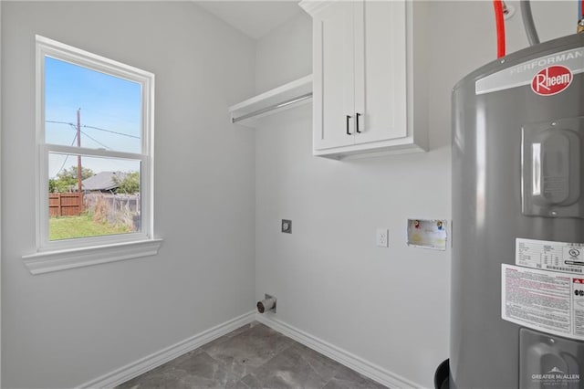 1003 Short Rd, San Juan, TX 78589 - laundry area featuring hookup for a washing machine, electric water heater, electric dryer hookup, cabinet space, and baseboards