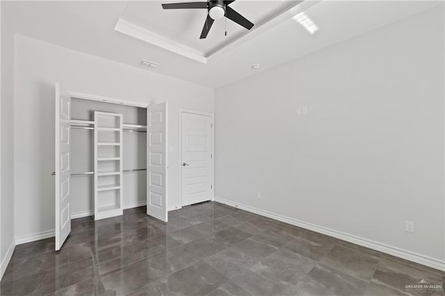 1003 Short Rd, San Juan, TX 78589 - unfurnished bedroom with baseboards, visible vents, a ceiling fan, a closet, and a raised ceiling