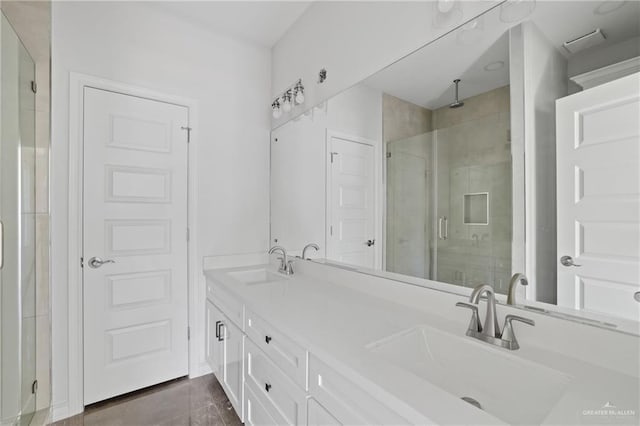 1003 Short Rd, San Juan, TX 78589 - full bathroom with a sink, double vanity, and a stall shower