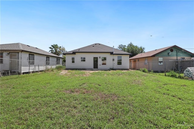 1003 Short Rd, San Juan, TX 78589 - back of house featuring a lawn and a fenced backyard