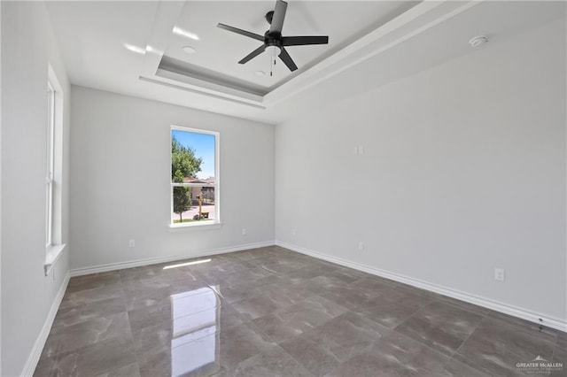 1003 Short Rd, San Juan, TX 78589 - empty room featuring ceiling fan, baseboards, and a raised ceiling