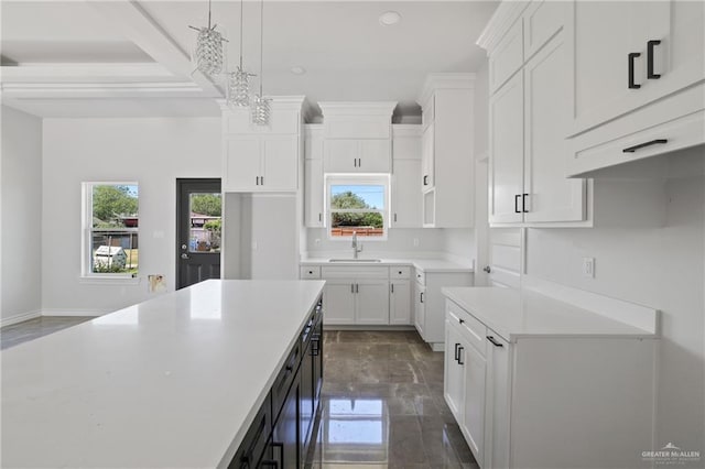 1003 Short Rd, San Juan, TX 78589 - kitchen featuring white cabinets, a sink, recessed lighting, pendant lighting, and light countertops