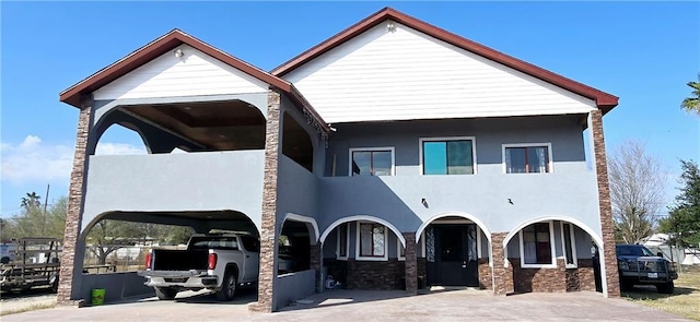 exterior space with a carport