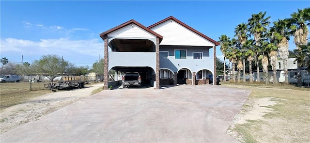 view of front of home featuring a carport