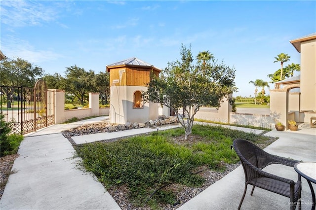 exterior space featuring a patio area and an outdoor fireplace