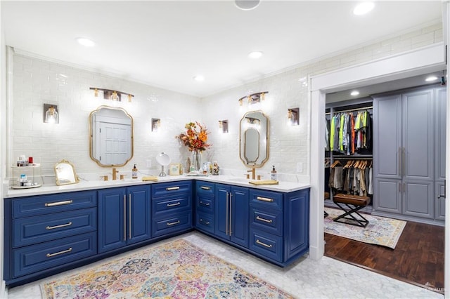 bathroom with vanity and wood-type flooring