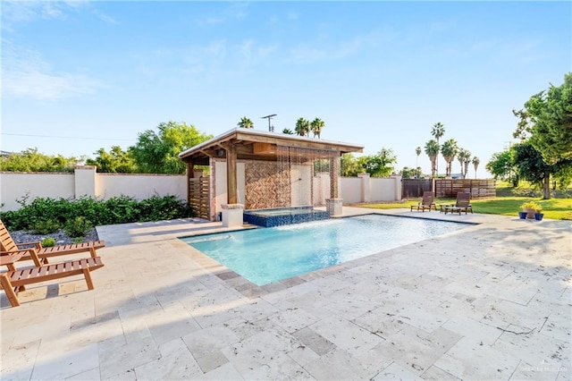 view of swimming pool with pool water feature, an in ground hot tub, and a patio