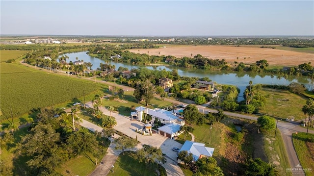 aerial view with a rural view and a water view