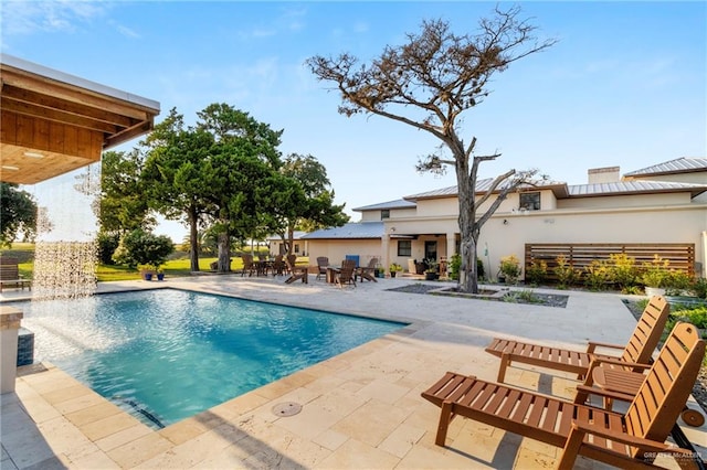 view of swimming pool featuring a patio