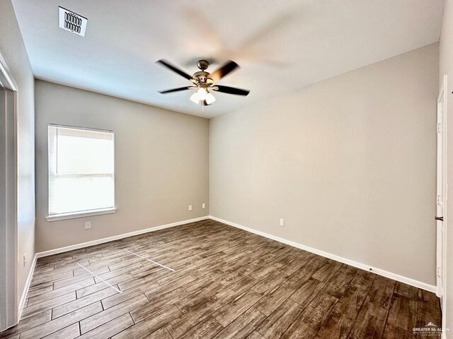 unfurnished room with hardwood / wood-style floors and ceiling fan