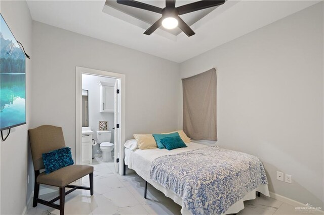 915 Rockford Dr, Alton, TX 78573 - bedroom featuring light marble finish flooring, ensuite bathroom, and a ceiling fan