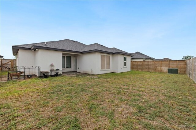 915 Rockford Dr, Alton, TX 78573 - rear view of property with stucco siding