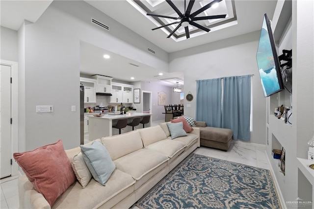 915 Rockford Dr, Alton, TX 78573 - living area with a ceiling fan, light marble finish flooring, and recessed lighting