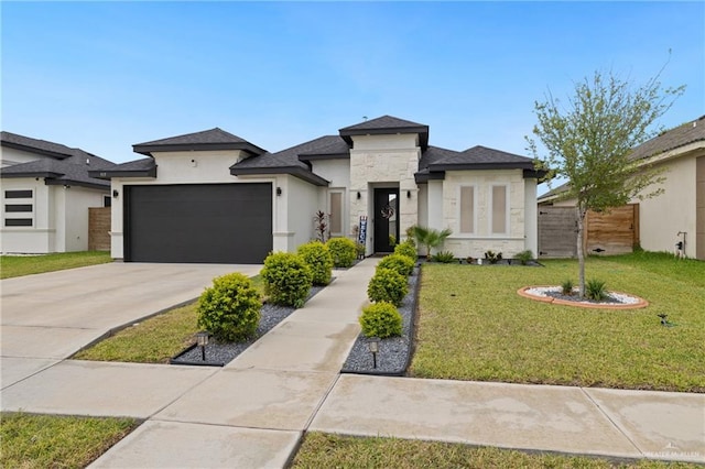 915 Rockford Dr, Alton, TX 78573 - prairie-style house with a garage, stone siding, stucco siding, and concrete driveway