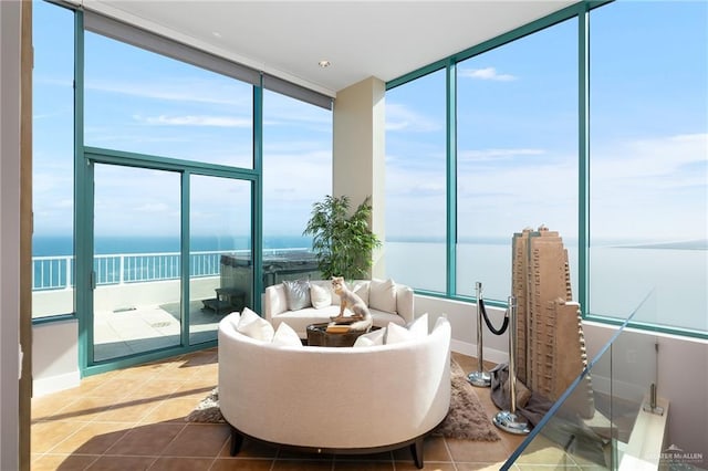 310-A Padre Blvd Unit 3102, South Padre Island, TX 78597 - living area with a water view, healthy amount of natural light, expansive windows, and tile patterned floors