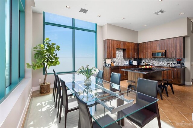 310-A Padre Blvd Unit 3102, South Padre Island, TX 78597 - dining area with light tile patterned floors, baseboards, and recessed lighting