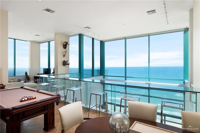 310-A Padre Blvd Unit 3102, South Padre Island, TX 78597 - recreation room featuring rail lighting, floor to ceiling windows, a water view, pool table, and tile patterned floors