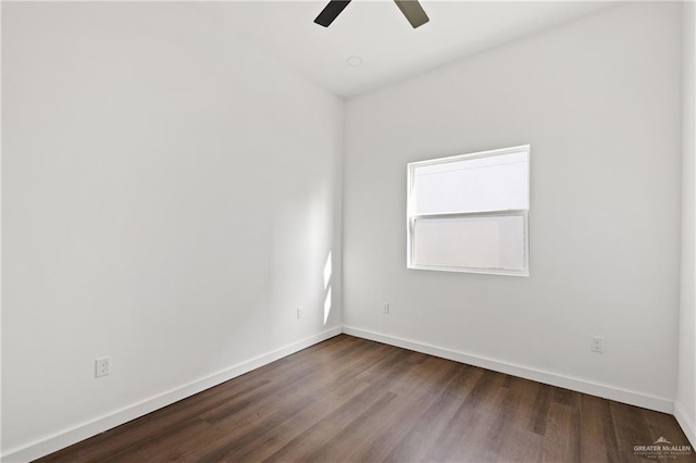 spare room with a ceiling fan, baseboards, and wood finished floors