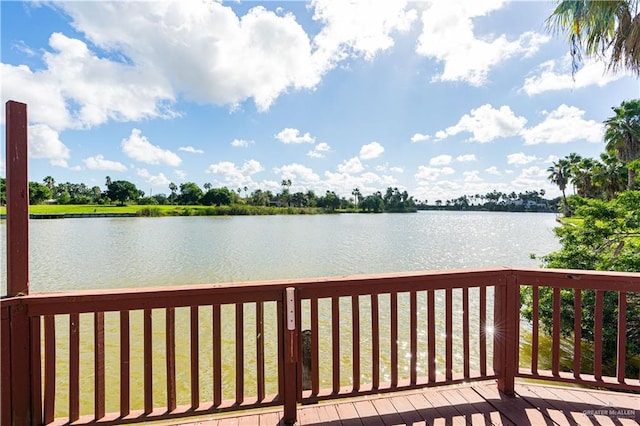 wooden deck with a water view