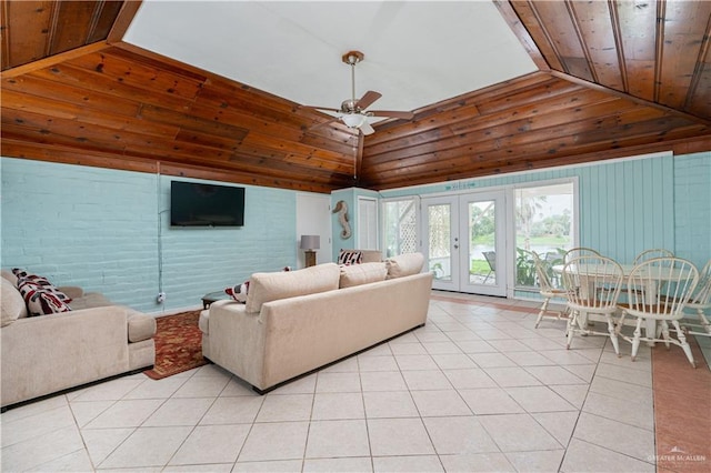 tiled living room featuring french doors, vaulted ceiling, ceiling fan, and wood ceiling