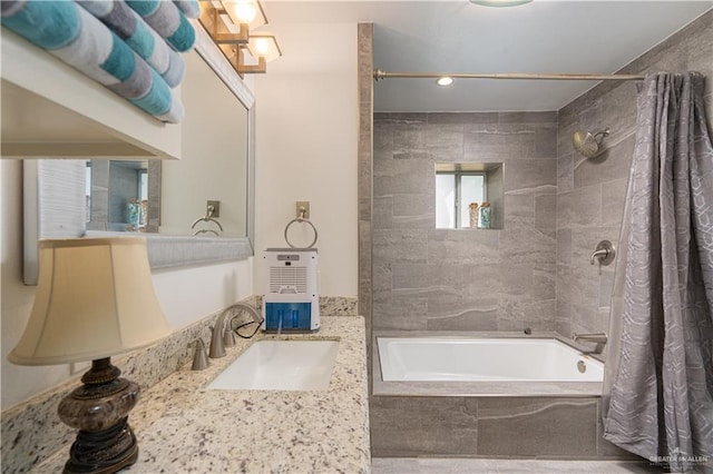 bathroom featuring vanity and shower / tub combo