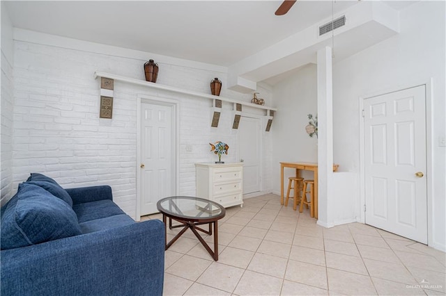 interior space featuring light tile patterned floors and ceiling fan