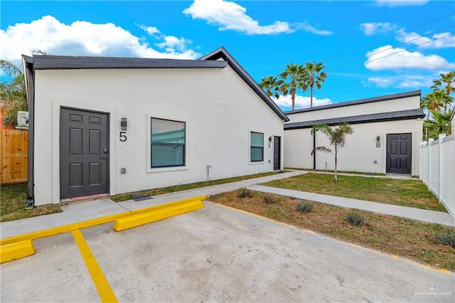 106 W Corral St, South Padre Island, TX 78597 - rear view of house featuring a lawn