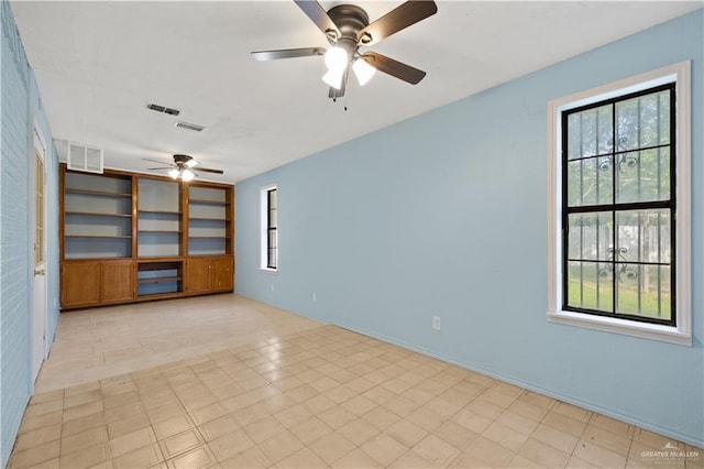 3401 Del Norte Dr, Mission, TX 78574 - spare room with visible vents, a ceiling fan, and built in shelves