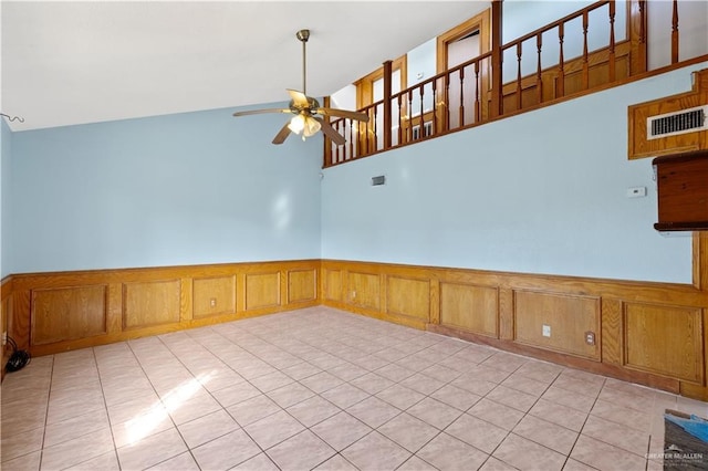 3401 Del Norte Dr, Mission, TX 78574 - empty room featuring light tile patterned flooring, visible vents, ceiling fan, and wainscoting