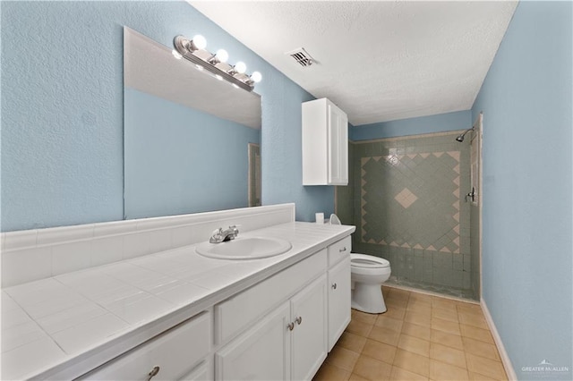3401 Del Norte Dr, Mission, TX 78574 - bathroom featuring a stall shower, toilet, visible vents, tile patterned flooring, and vanity