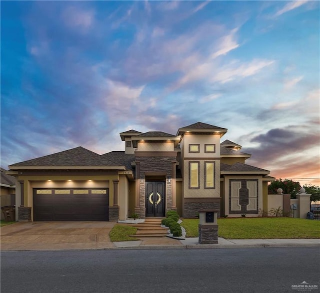 2410 W Vancouver Ave, Edinburg, TX 78539 - prairie-style house featuring stone siding, driveway, a garage, and stucco siding