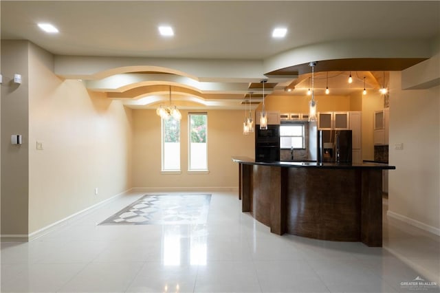 2410 W Vancouver Ave, Edinburg, TX 78539 - kitchen featuring fridge with ice dispenser, dark countertops, baseboards, recessed lighting, and light tile patterned flooring