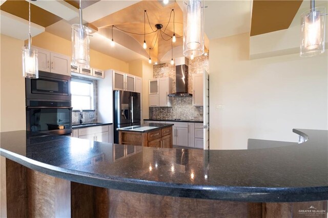 2410 W Vancouver Ave, Edinburg, TX 78539 - kitchen with black appliances, wall chimney range hood, tasteful backsplash, a sink, and hanging light fixtures