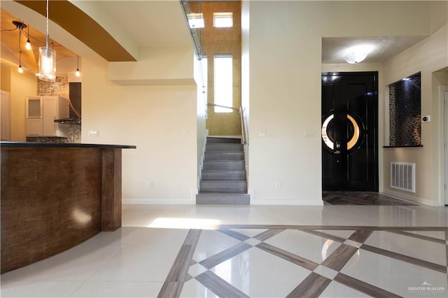 2410 W Vancouver Ave, Edinburg, TX 78539 - entrance foyer featuring baseboards and stairway