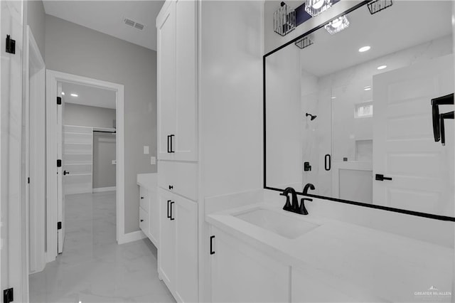 full bath featuring recessed lighting, vanity, visible vents, marble finish floor, and a stall shower