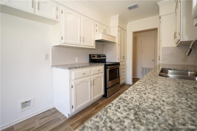 kitchen featuring custom exhaust hood, white cabinets, sink, stainless steel electric range oven, and light stone counters