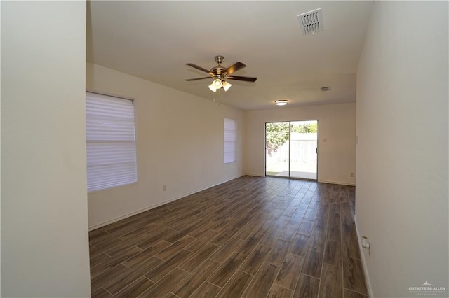 unfurnished room with dark hardwood / wood-style floors and ceiling fan