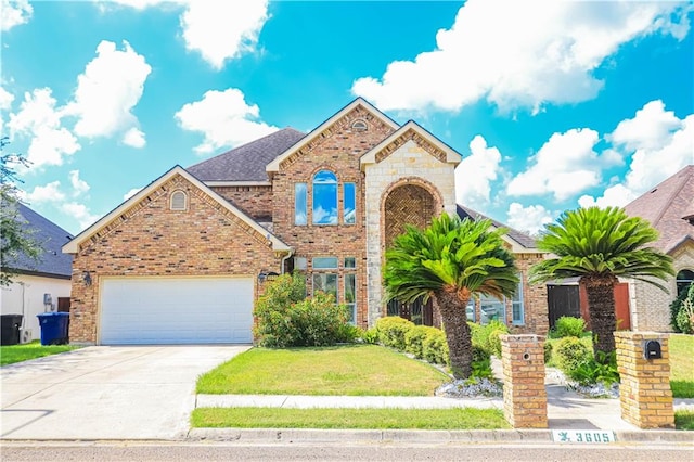 view of front of house with a garage and a front yard