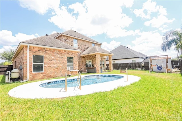 view of pool featuring a yard