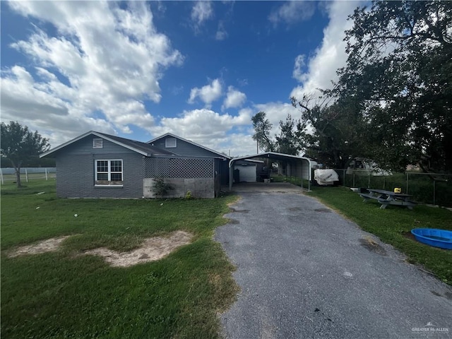 147 E Minnesota Rd Unit 3, Alamo, TX 78516 - ranch-style home featuring a detached carport and driveway