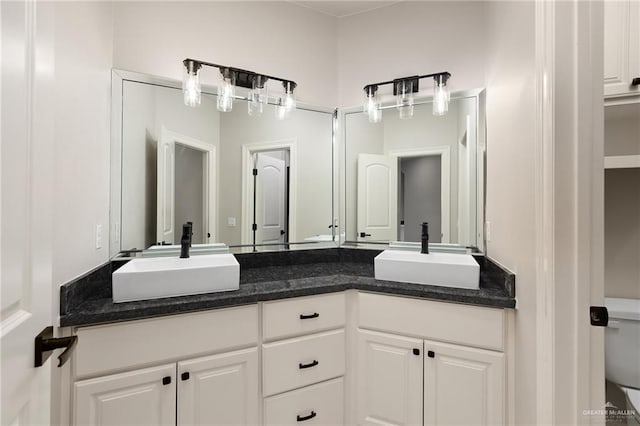 bathroom with vanity and toilet