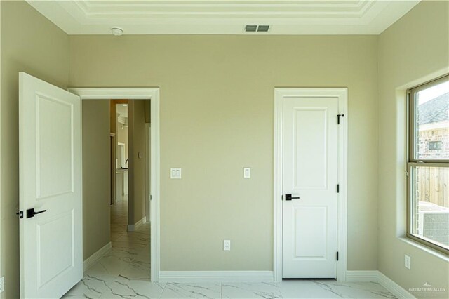 8801 Swan Lake Dr, Harlingen, TX 78550 - unfurnished bedroom with marble finish floor, baseboards, and visible vents