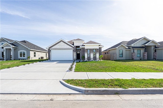 8801 Swan Lake Dr, Harlingen, TX 78550 - view of front facade featuring concrete driveway, an attached garage, and a front lawn
