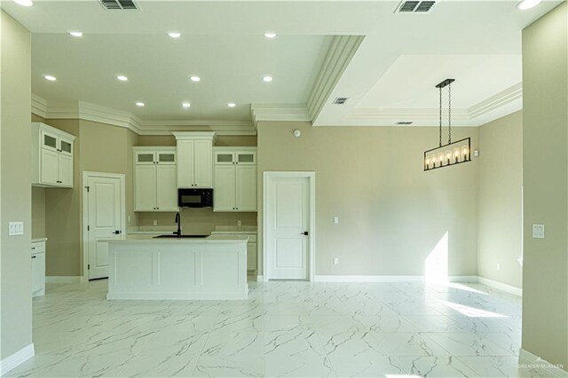 8801 Swan Lake Dr, Harlingen, TX 78550 - kitchen featuring black microwave, marble finish floor, and baseboards