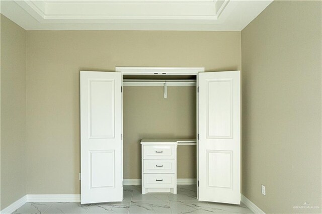 8801 Swan Lake Dr, Harlingen, TX 78550 - unfurnished bedroom with marble finish floor, a closet, and baseboards