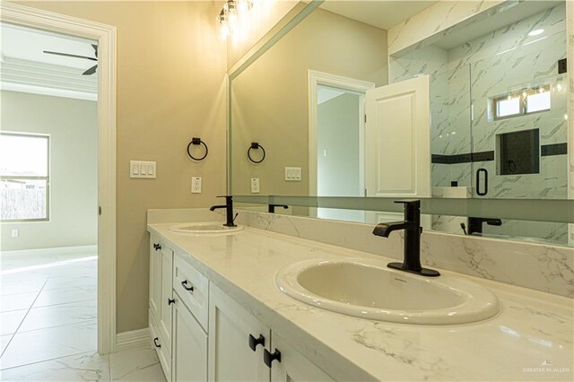 8801 Swan Lake Dr, Harlingen, TX 78550 - bathroom with double vanity, marble finish floor, a marble finish shower, and a sink