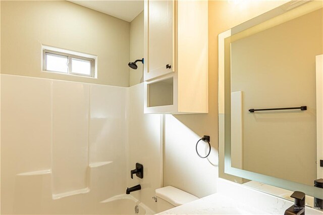 8801 Swan Lake Dr, Harlingen, TX 78550 - bathroom with bathtub / shower combination, vanity, and toilet