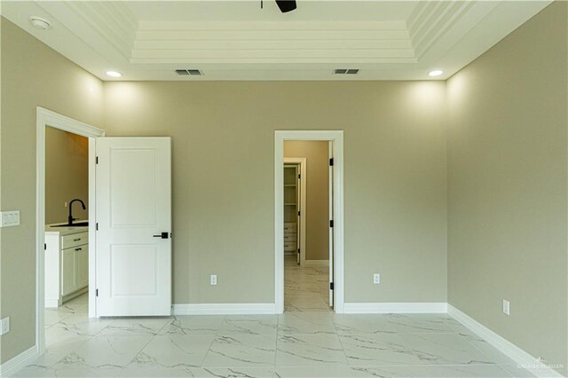 8801 Swan Lake Dr, Harlingen, TX 78550 - unfurnished bedroom with marble finish floor, visible vents, baseboards, and a sink